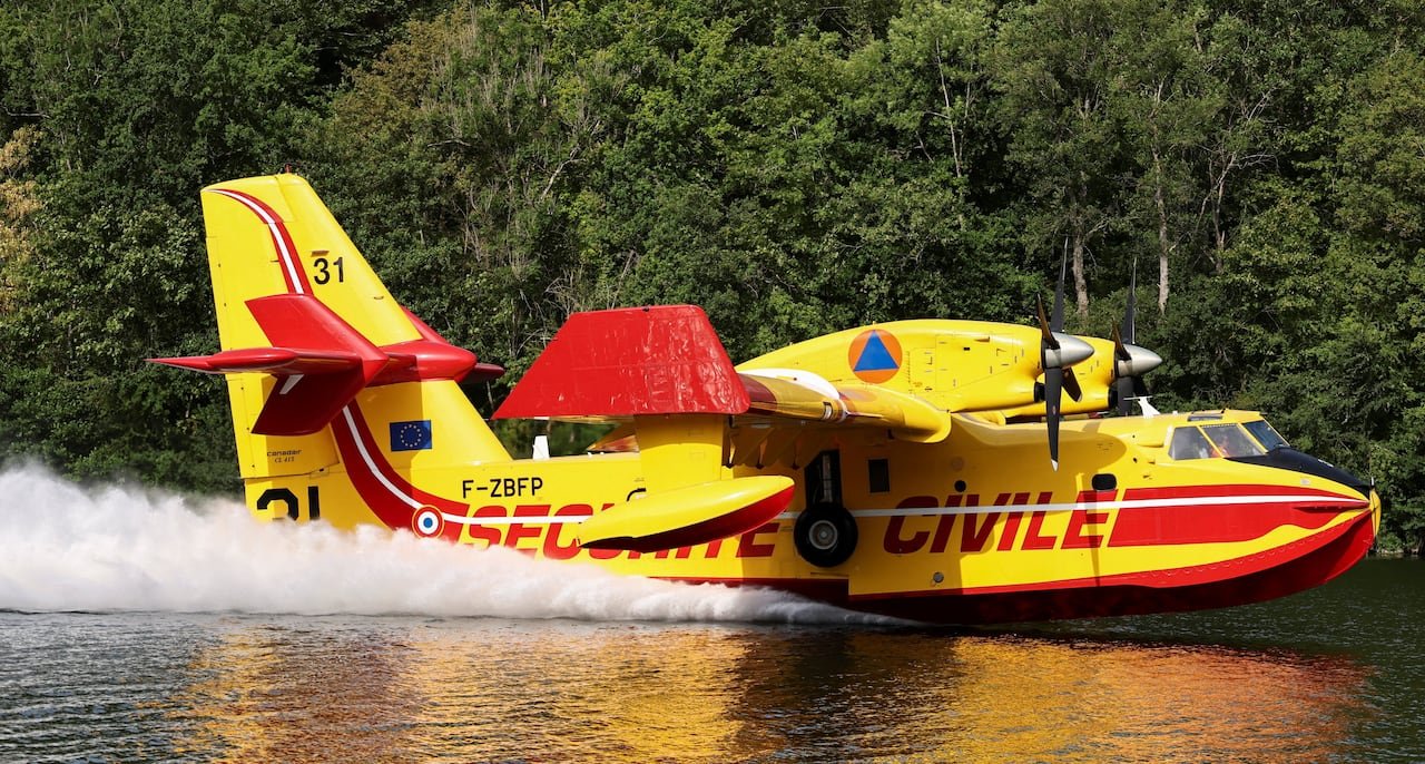 A Canadair aircraft collects water from the River Seine in Ivry-sur-Seine as it assists efforts fighting a wildfire in the Fontainebleau forest near Paris on July 14.