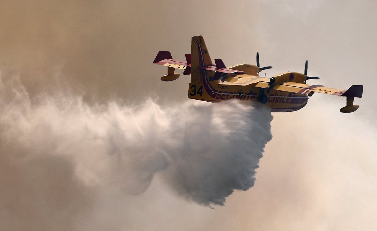 A Canadair aircraft drops water on a wildfire in the Fox-Amphoux communal forest near Ponteves, France, on July 21.
